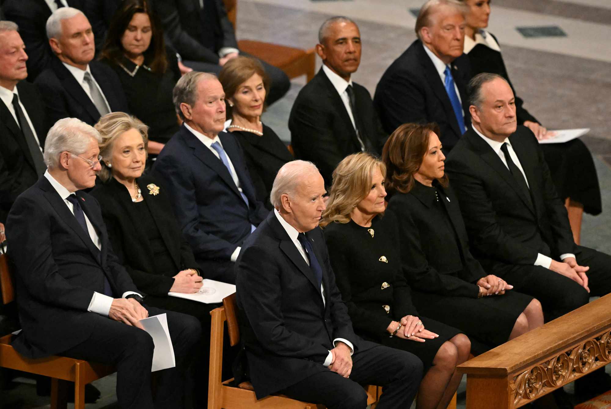 current and former presidents and vice presidents with spouses at Jimmy Carter's funeral, includes: Joe Biden and Wife Dr. Jill, Kamala Harris and Doug, Donald Trump with Melania, Barack Obama, the Clinton's and Pences